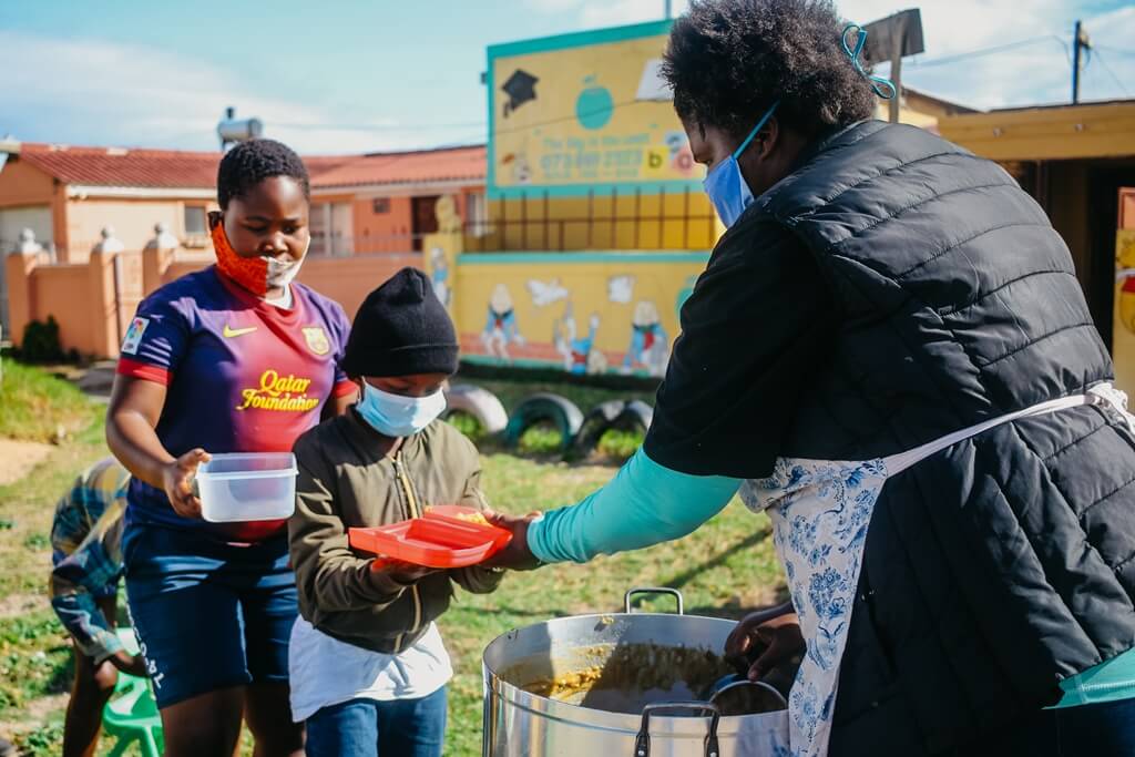 Children receiving food at Kwazakhele soup kitchen