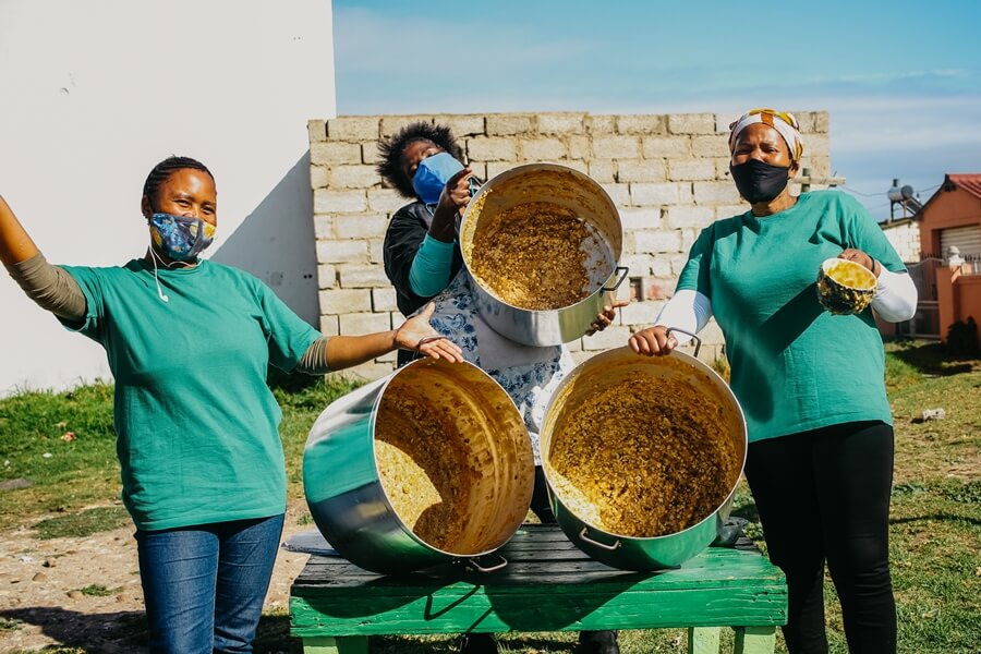 Ladies celebrating at Kwazakhele soup kitchen